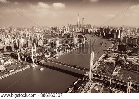 Shanghai Nanpu Bridge over Huangpu River with busy traffic in China.