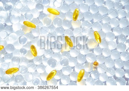 Omega3 Gel Capsules. Yellow Vitamin. Dietology Drug. Fish Oil Supplement. Microdosing Concept. Golde
