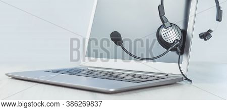 Laptop. Mockup Screen And Headphones On Grey Desk And Plain Background Banner. Distant Learning Or W