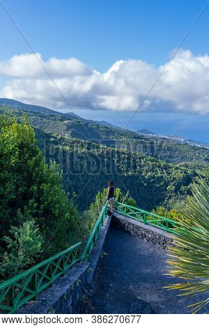 A Young Woman At The Mirador Del Parque Natural De Cubo De La Galga On The Northeast Coast On The Is