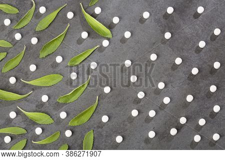 Pills And Green Leaves Of The Stevia Plant - Stevia Rebaudiana.