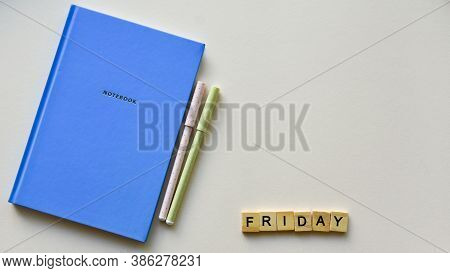 Blue Notebook With Two Pens And Wooden Word 