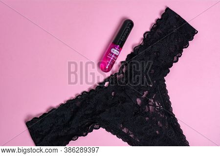Kyiv, Ukraine - 15 July 2020: Durex Intense Orgasmic Gel Near Women's Black Panties On A Pink Backgr