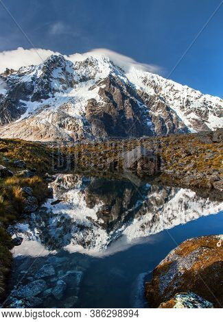 Evening View Of Mount Salkantay Mirroring In Lake, Salkantay Trek In The Way To Machu Picchu, Cuzco 