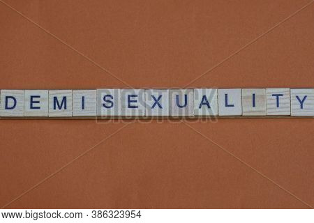 Gray Word Demisexuality Made Of Wooden Square Letters On Brown Dark Background