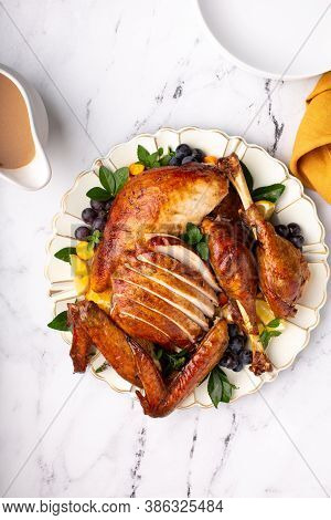 Carved Roasted Turkey For The Calebration Thanksgiving Or Christmas Dinner On A Plate Overhead Shot