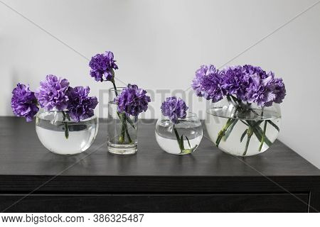 Bridal Bouquets Of Lilac Carnations In A Four Round Glass Vases Different Sizes As Table Decoration