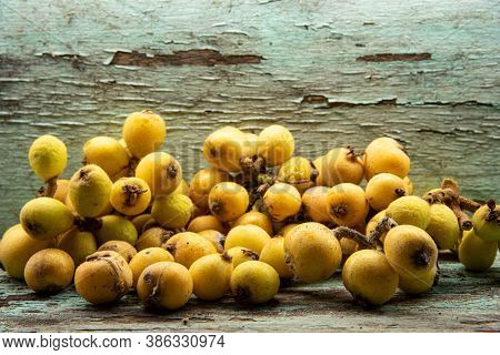 Yellow Loquat Fruits (eriobotrya Japonica) On Wooden Background