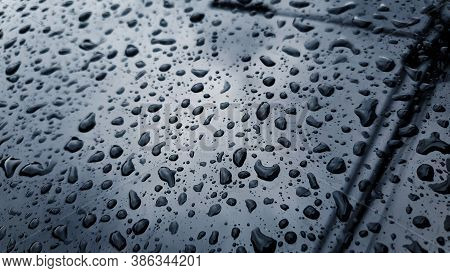 Rain Drop On The Glass Mirror Wall.