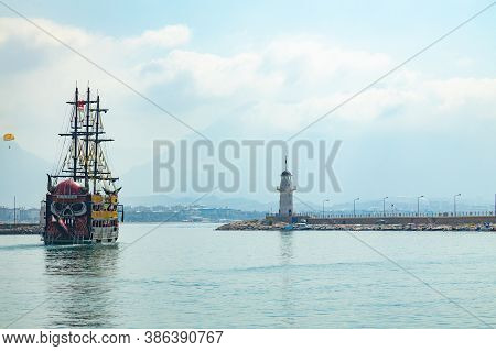 Alanya, Turkey - 28 Aug, 2020: Shore Line With Tourist Recreational Ship Called Vikingen Coming Out 