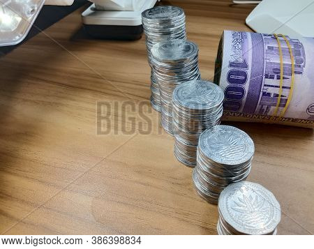 Bangladeshi Bank Note With Coin Closeup On Wooden Table