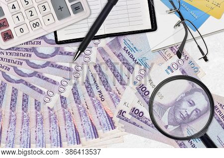 100 Philippine Piso Bills And Calculator With Glasses And Pen. Tax Payment Season Concept Or Investm