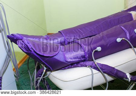Pressotherapy In The Spa Salon For The Beauty And Health Of The Legs. A Procedure For Treating Legs 
