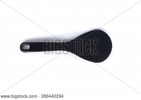 Plastic, Heat-resistant Spoon Stirrer For Multicooker. Black Spoon Isolated On White Background.