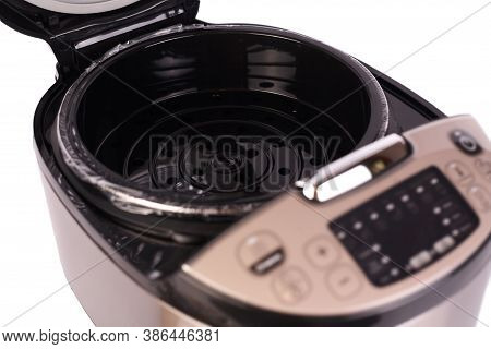 Automatic Modern Multicooker Isolated On White Background. Household Appliances Programmed For The P
