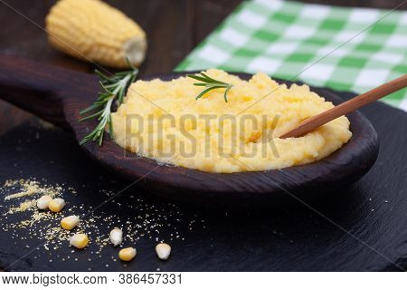 Mamaliga Or Polenta Porridge Made Out Of Yellow Maize Flour. Homemade Palenta In Wooden Bowl, Tradit