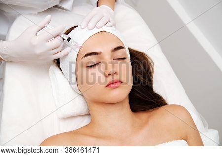 Woman Getting Cosmetic. Injection. Beauty Injections And Cosmetology.  Young Woman In Beauty Salon S