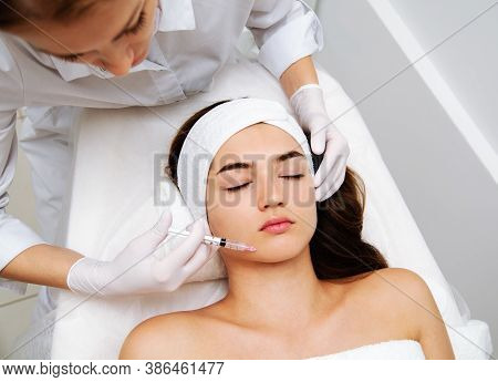 Woman Getting Cosmetic. Injection. Beauty Injections And Cosmetology.  Young Woman In Beauty Salon S