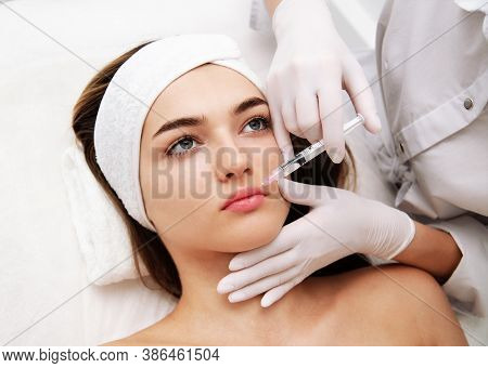 Woman Getting Cosmetic. Injection. Beauty Injections And Cosmetology.  Young Woman In Beauty Salon S