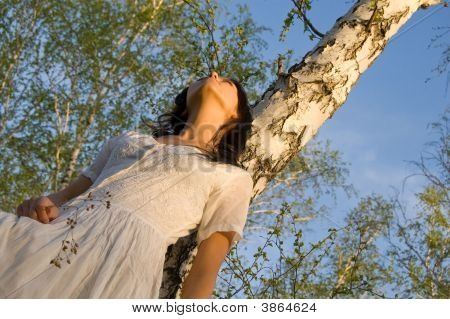 Beauty Girl Near The Birch Tree
