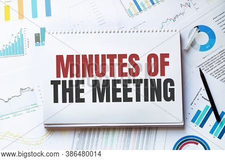 Notebook With Tools And Notes With Text Minutes Of The Meeting