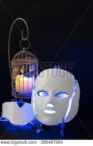 White Plastic Color Therapy Mask Glowing Blue With Cage Canle Holde And Candle