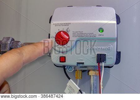 Calgary, Alberta, Canada. Sep 22, 2020. A Person Adjusting A Honeywell Gas Control Valve, Residentia