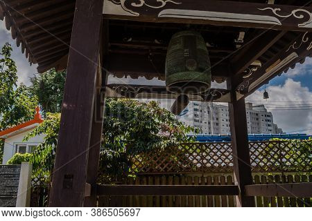 Geumsan, South Korea; September 12, 2020: Low Angle View Of Bell And Striker In Wooden Pavilion At D