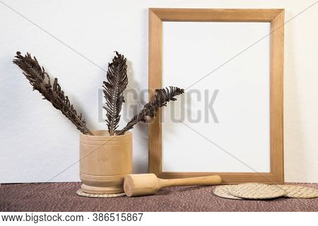 Portrait empty wooden frame mockup with yellow apples. White background. Scandinavian interior, home