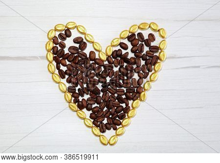 Heart Of Gold Coffee Beans On A Wooden Board