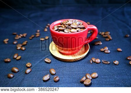 Espresso Cup With Coffee Beans On A Black Background