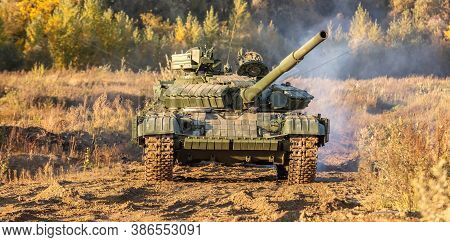 A Front Shot Of Russian Tank T-64 Moving In The Field.