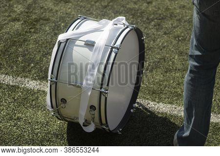 Big Drum At A Football Match. A Man With A Braban To Support Football Players. White Percussion Musi
