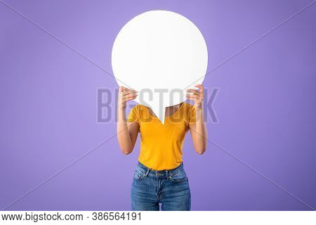 Information, Thought, Quote And Opinion Concept. Young Woman Hiding Her Face Behind Blank White Spee