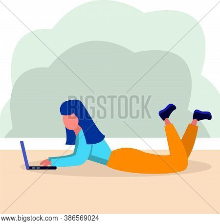 girl lying on the floor and working on a laptop, remote work