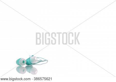Colorful Mint Earphones Isolated On White Background. Playlist, Podcast, Entertainment Gadget, Relax
