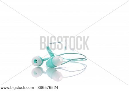 Colorful Mint Earphones Isolated On White Background. Playlist, Podcast, Entertainment Gadget, Relax