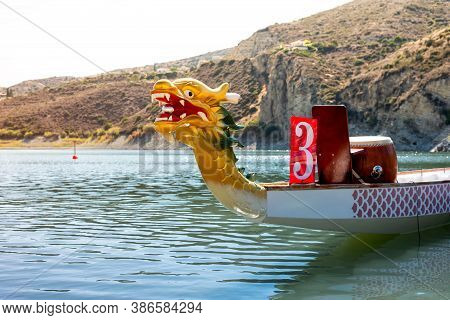 A Brightly Coloured Dragon Boat On The River