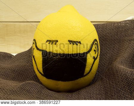 Lemon In A Hand-drawn Black Mask As A Background For The Text. Concept Idea