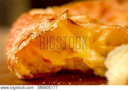 Close-up. Melted Cheese Into The Core Of A Cheese Cake. Broken Turkish Cheesecake. Pita With Cheese 