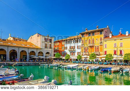 Desenzano Del Garda, Italy, September 11, 2019: Old Harbour Porto Vecchio With Boats On Turquoise Wa