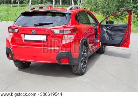 Russia, Izhevsk - August 13, 2020: New Modern Subaru Xv Car With Open Door Passenger. Back And Sive 