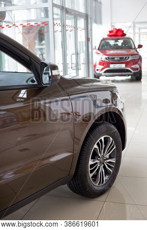 Russia, Izhevsk - August 14, 2020: New Modern Cars In The Geely Showroom. Front And Side View. Car
