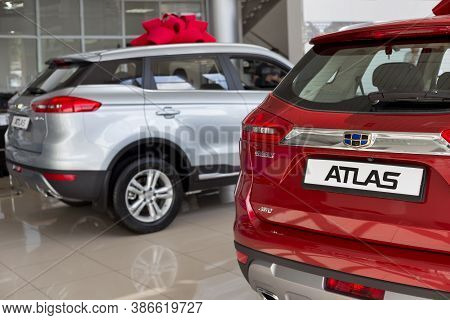 Russia, Izhevsk - August 14, 2020: New Modern Atlas And Other Cars In The Geely Showroom.