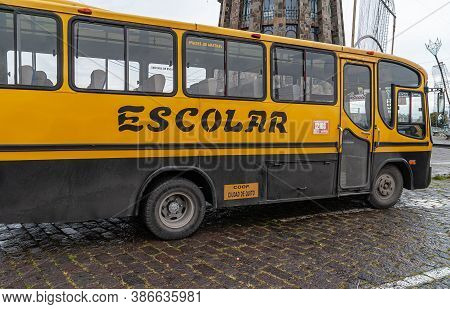 Quito, Ecuador - December 2, 2008: Cerro El Panecillo. Yellow School Bus Parked Under The Statue In 