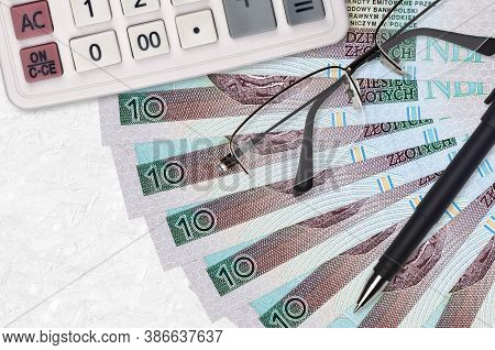 10 Polish Zloty Bills Fan And Calculator With Glasses And Pen. Business Loan Or Tax Payment Season C