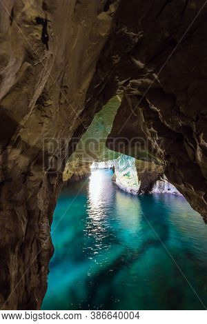  Karst cave Rosh-a-Nikra on the shores of the Mediterranean Sea. Israel. The color of sea water changes from azure to dark blue. The concept of active, environmental and photo tourism