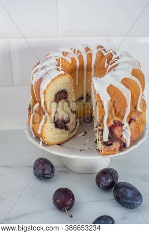 Typical German Poppy Seed Plum Gugelhupf Cake On A Table