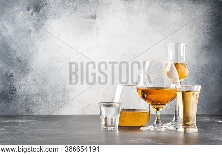 Set Of Hard Strong Alcoholic Drinks And Spirits In Glasses In Assortment: Vodka, Cognac, Tequila, Br