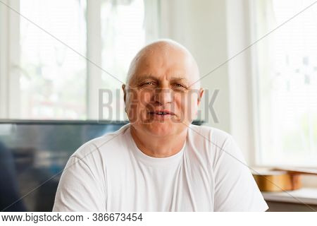 Head Shot Close Up Happy Grandfather Looking At Camera, Talking To Grown Up Children Or Communicatin
